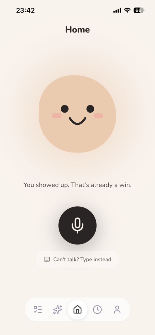 The TinyWins home screen: Pip smiling above the words 'You showed up. That's already a win.' with a microphone button below